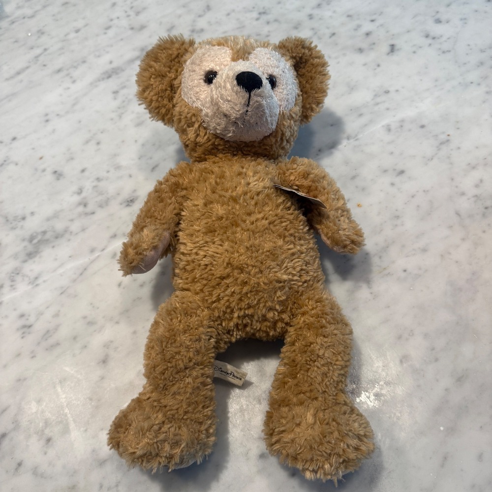 Preowned Disney Parks Duffy the Disney Bear plush with original tag attached